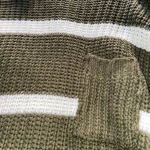 Green knitted sweater with white stripes